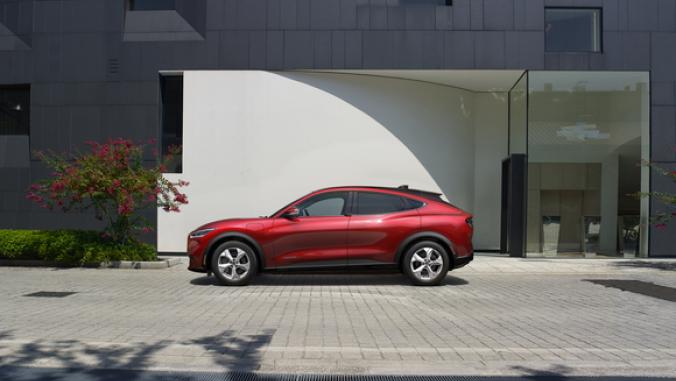 red car on a street