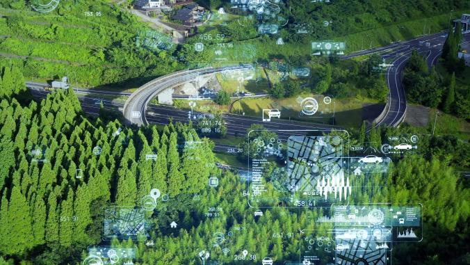 A highway winding through a green forest with various data points illustrated