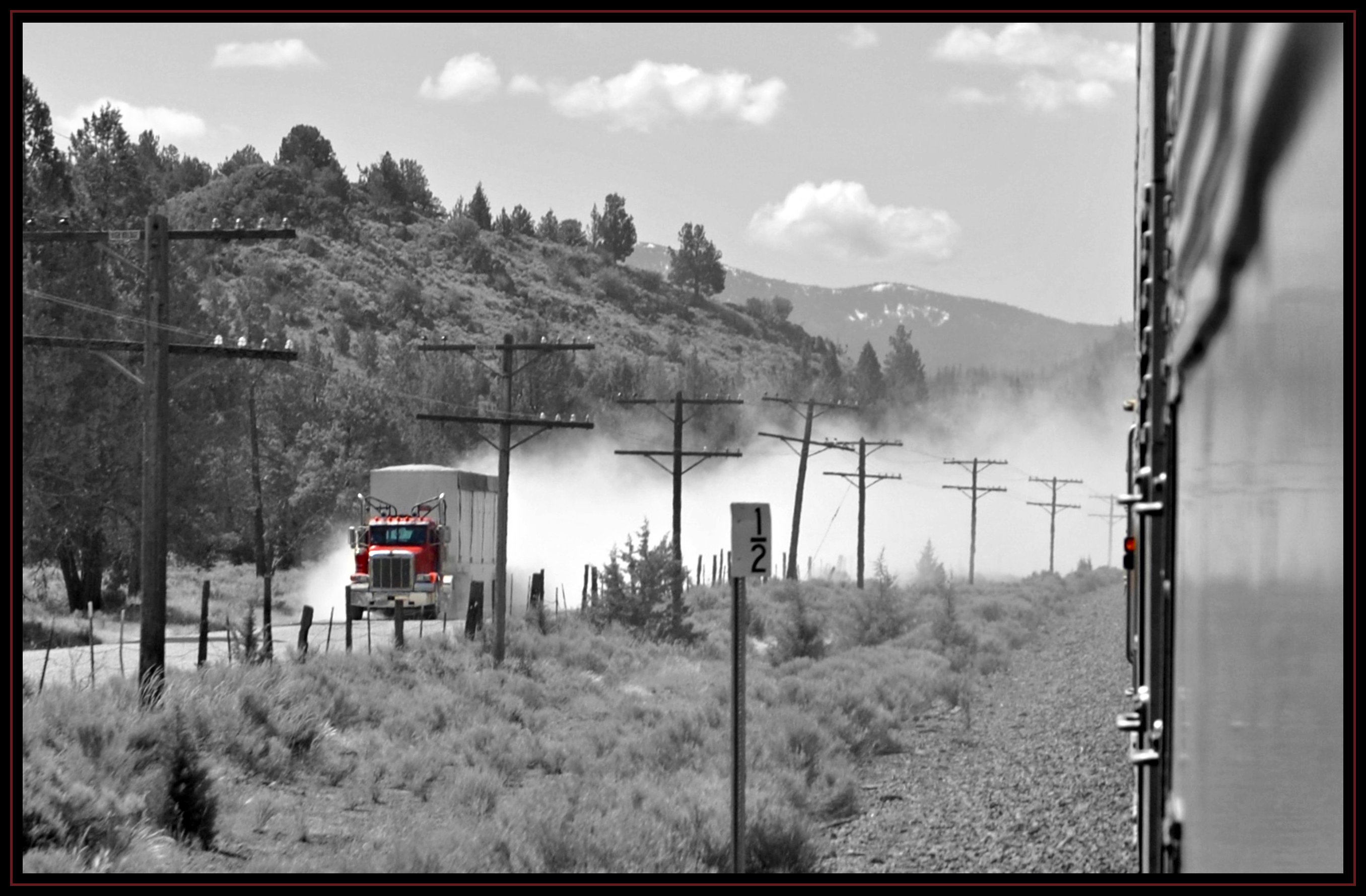 A big-rig approaches on a dirt road near Upper Klamath Lake, Oregon.