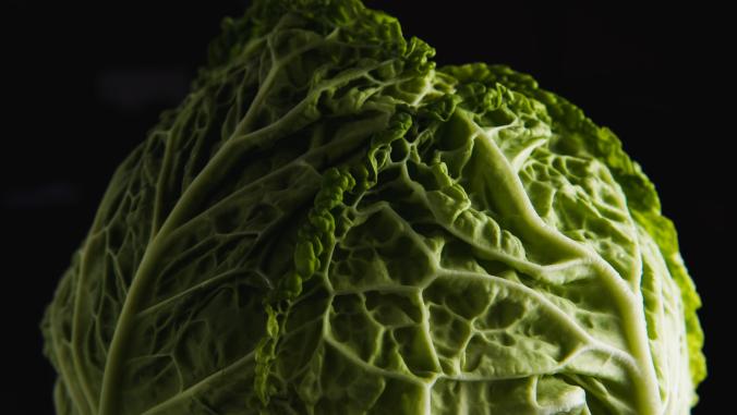 Head of cabbage with a black background