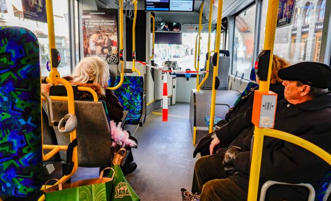 People riding a public bus in Stockholm, Sweden